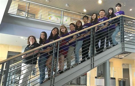 eva enghel hard|Eva Engelhard with international students on stairway in building .